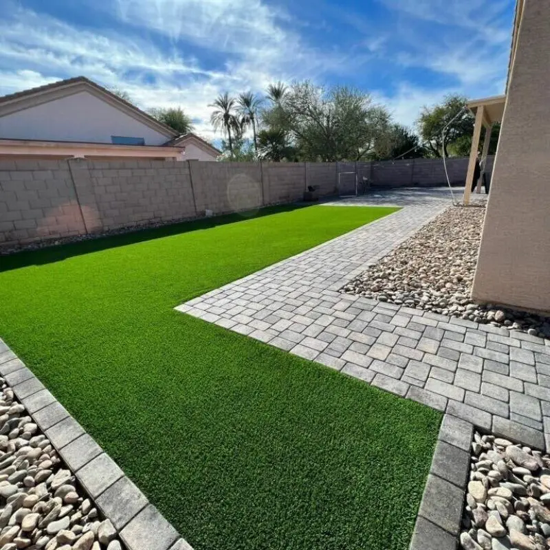 Rock landscaping installation — river rock and boulder design in Arizona yard