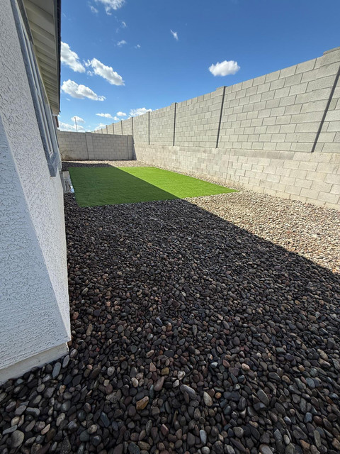 Polished decorative stone landscaping in Phoenix backyard